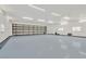 Garage features high ceilings, lighting, and a large bay door at 11908 Pilot Country Dr, Spring Hill, FL 34610