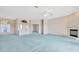 Open living room showcases a fireplace, archway entrance, and ample natural light at 11908 Pilot Country Dr, Spring Hill, FL 34610