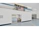 Upper loft area overlooking the garage, with an American flag and storage shelves at 11908 Pilot Country Dr, Spring Hill, FL 34610
