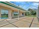 Large, covered patio boasts a screened-in enclosure with great views at 11908 Pilot Country Dr, Spring Hill, FL 34610