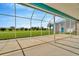 Spacious screened-in patio area overlooking green backyard at 11908 Pilot Country Dr, Spring Hill, FL 34610
