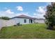 Wide backyard features a privacy fence, and well-maintained lawn at 12138 Criollo Rd, Spring Hill, FL 34610