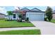 Charming single-Gathering home with a well-manicured lawn, beautiful landscaping, and a two-car garage at 12138 Criollo Rd, Spring Hill, FL 34610