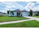 Charming one-story home featuring a lush lawn and well-maintained landscaping at 12138 Criollo Rd, Spring Hill, FL 34610