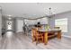 Spacious open-concept kitchen, dining, and living area featuring modern finishes and plenty of natural light at 12138 Criollo Rd, Spring Hill, FL 34610