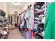 Large walk-in closet with organized shelving, hanging rods, and plenty of room for storage of clothes and accessories at 12138 Criollo Rd, Spring Hill, FL 34610
