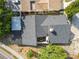 Top-down aerial view shows roof, patio, and landscaping, framed by neighborhood trees at 12234 Cider Mill Ln, Hudson, FL 34667