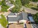 Aerial view of charming home with well-maintained landscape, pool, and grey shingled roof at 12234 Cider Mill Ln, Hudson, FL 34667