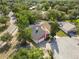 An aerial view of the roof and mature trees surrounding the house and neighborhood at 12234 Cider Mill Ln, Hudson, FL 34667