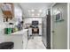 Functional kitchen with white cabinets, stainless steel appliances, and a tray ceiling at 12234 Cider Mill Ln, Hudson, FL 34667