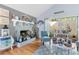 Living room with brick fireplace and outdoor access at 12234 Cider Mill Ln, Hudson, FL 34667