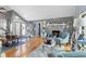 Inviting living room features hardwood floors, a grey brick fireplace, and comfortable seating at 12234 Cider Mill Ln, Hudson, FL 34667