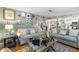 Comfortable living room with seating, hardwood floors, and bright lighting at 12234 Cider Mill Ln, Hudson, FL 34667