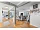 Open-concept living room with hardwood floors, fireplace, and lots of natural light at 12234 Cider Mill Ln, Hudson, FL 34667