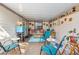 Bright and open patio with comfortable seating, a coffee table, and lots of décor at 12234 Cider Mill Ln, Hudson, FL 34667