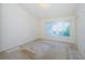 Empty bedroom with neutral carpet, a window and window blinds at 1241 Redondo Way, Wesley Chapel, FL 33543