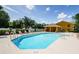 Relaxing community pool area with lounge chairs and a shaded pavilion for residents to enjoy at 1241 Redondo Way, Wesley Chapel, FL 33543