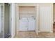 Convenient laundry closet featuring a side-by-side washer and dryer and additional storage space at 1241 Redondo Way, Wesley Chapel, FL 33543