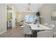 Open floor plan showcasing a combined living and dining area with a fireplace and powder room at 1241 Redondo Way, Wesley Chapel, FL 33543