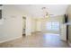 Versatile living area with tile flooring, natural light, and easy access to a powder room at 1241 Redondo Way, Wesley Chapel, FL 33543