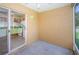 Porch with view to the kitchen with tile flooring at 1241 Redondo Way, Wesley Chapel, FL 33543