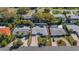 Aerial view of the home showing the pool, driveway, and surrounding greenery at 1320 Dixie S Ln, St Petersburg, FL 33707