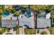 A bird's eye view of the home showing the backyard with swimming pool, landscaping, and surrounding neighborhood at 1320 Dixie S Ln, St Petersburg, FL 33707