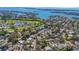 A high aerial view shows home's location near a golf course and waterway at 1320 Dixie S Ln, St Petersburg, FL 33707