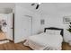 Bright bedroom with access to kitchen and bathroom, wood-look floors, and modern decor at 1320 Dixie S Ln, St Petersburg, FL 33707
