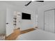 Bright bedroom with en suite bathroom, recessed lighting, and wood-look flooring at 1320 Dixie S Ln, St Petersburg, FL 33707