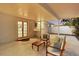 Inviting covered patio with comfortable seating, perfect for outdoor dining and relaxing by the pool at 1320 Dixie S Ln, St Petersburg, FL 33707