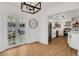 Bright dining area leading to a renovated kitchen with modern appliances and ample counter space at 1320 Dixie S Ln, St Petersburg, FL 33707