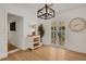 Inviting entryway featuring wood-look floors, decorative lighting, and convenient access to the living areas at 1320 Dixie S Ln, St Petersburg, FL 33707
