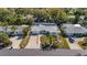 Charming single story home with a well-manicured front yard and mature palm trees in a desirable neighborhood at 1320 Dixie S Ln, St Petersburg, FL 33707