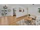 Bright and open living room featuring wood floors, stylish furniture, and views to the kitchen and back patio at 1320 Dixie S Ln, St Petersburg, FL 33707