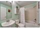 Well-lit bathroom features a sink, toilet, and bathtub-shower combination with modern fixtures and clean design at 13252 Graham Yarden Dr, Riverview, FL 33579