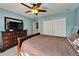 Spacious bedroom with a closet, dresser and TV, offering a comfortable and private retreat at 13252 Graham Yarden Dr, Riverview, FL 33579