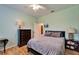 Cozy bedroom with a comfortable bed, side tables, and a dresser, providing a relaxing retreat at 13252 Graham Yarden Dr, Riverview, FL 33579