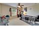 Bright bedroom featuring a large window, ceiling fan, and comfortable furnishings, creating a cozy retreat at 13252 Graham Yarden Dr, Riverview, FL 33579