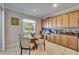 Cozy breakfast nook with natural light, adjacent to kitchen with tiled floors at 13252 Graham Yarden Dr, Riverview, FL 33579