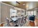 Elegant dining room featuring a modern chandelier and a spacious seating arrangement at 13252 Graham Yarden Dr, Riverview, FL 33579
