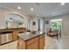 Bright kitchen with granite counters, stainless steel appliances, and an island with barstools at 13252 Graham Yarden Dr, Riverview, FL 33579