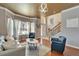 Inviting living room with hardwood floors, stylish furnishings, and plenty of natural light at 13252 Graham Yarden Dr, Riverview, FL 33579