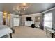 A spacious main bedroom featuring a large window, stylish wallpaper, and well-appointed furnishings at 13252 Graham Yarden Dr, Riverview, FL 33579