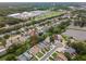 Aerial view of a neighborhood featuring lots of greenery and a large commercial area nearby at 1712 Azalea Ct # A, Oldsmar, FL 34677
