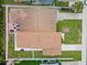 Overhead shot showing the roof of the house and property layout with fencing and green lawn at 1712 Azalea Ct # A, Oldsmar, FL 34677