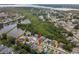 Aerial view of the neighborhood, nestled among trees and ponds, with views of the bay at 1712 Azalea Ct # A, Oldsmar, FL 34677