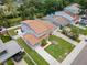 Expansive aerial view of a two-story home featuring a well-manicured lawn and white picket fence at 1712 Azalea Ct # A, Oldsmar, FL 34677