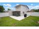 The backyard features a screened-in patio and a white fence at 1712 Azalea Ct # A, Oldsmar, FL 34677