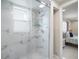 Bathroom features a modern glass-door shower with marble-style tiling at 1712 Azalea Ct # A, Oldsmar, FL 34677